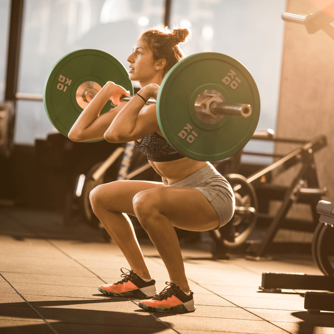 a woman doing a strength training session at InnerFit