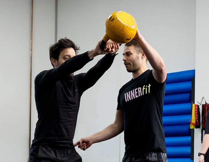 Personal Trainer working with a man in the gym