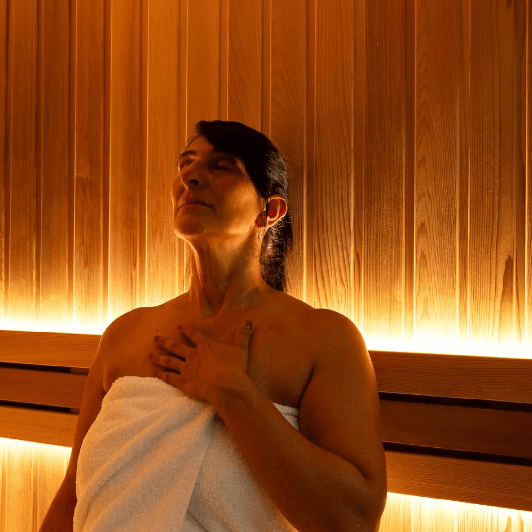 A member from InnerFit recovering after a workout class in the sauna