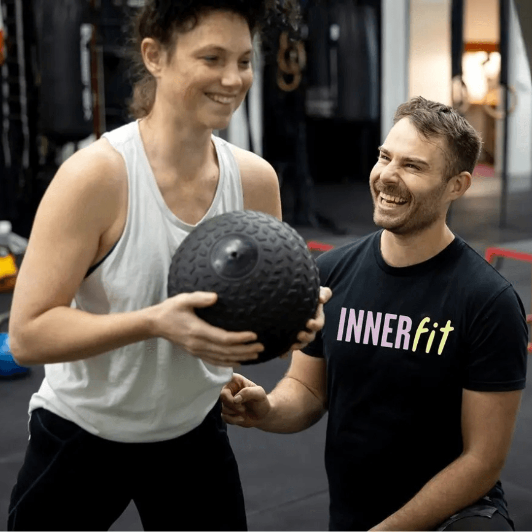 Scott from InnerFit training a client in a 1:1 strength training session